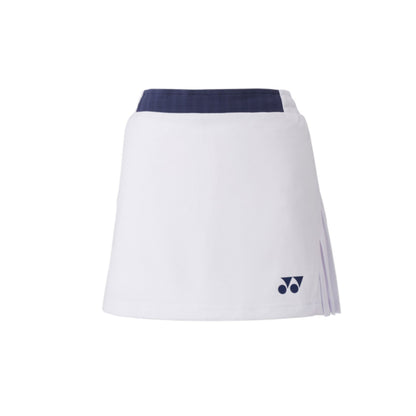 The Yonex 26094 Women's Skort from Yonex boasts a sleek white design with a navy waistband and a small navy logo near the hem. It features slight side pleats for style and includes UV reduction for enhanced comfort, set against its plain white background.