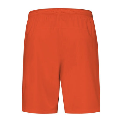 The back view of the Spicy Orange K-Swiss Hypercourt Men's Tennis Shorts displays a classic design. Featuring an elastic waistband and subtle vented detailing, these shorts are made from lightweight fabric, ideal for staying cool during intense matches.