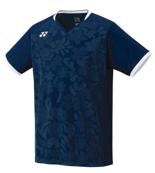 The Yonex 10502 Men's T-Shirt in Sapphire Navy showcases a subtle floral pattern on the front, complemented by white trim on the sleeves and collar. It is crafted from very cool stretch material for ultimate comfort.
