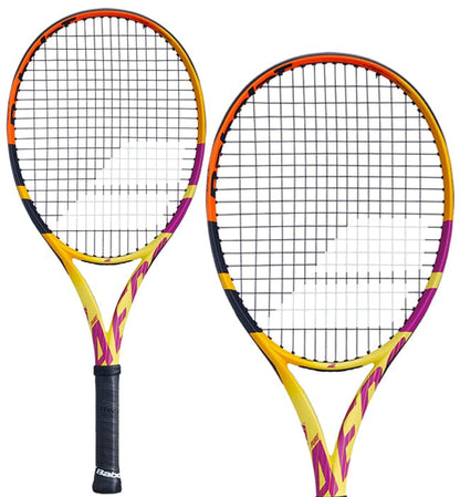 Two vividly designed Babolat Pure Aero RAFA Junior 26 Tennis Rackets, featuring accents in orange, yellow, and purple, highlight a dynamic aesthetic. These rackets incorporate spin technology and are equipped with a black grip and a precise mesh string pattern for outstanding performance.