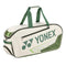 The Yonex 02331WEX Expert Tournament Bag, featuring a sleek white and moss green design, comes with green handles and prominently displays the Yonex logo on the side. Perfect for tournaments, this bag combines style with functionality, ensuring you carry your gear with confidence.