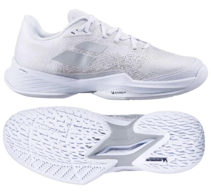 The Babolat Jet Mach 3 All Court Men's Tennis Shoes in White/Silver are displayed. The top shoe, incorporating Matryx Technology, showcases a silver logo on the side and a textured upper surface. Meanwhile, the bottom shoe highlights the patterned sole for improved traction and shock absorption.