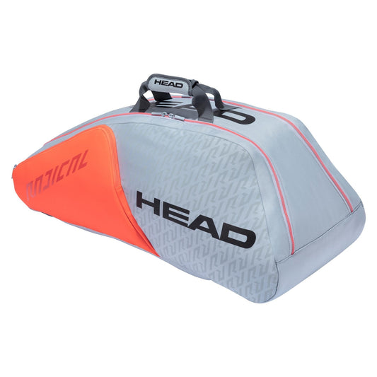 The HEAD Radical 9R Supercombi 9 Racket Tennis Bag in grey and orange displays the striking "HEAD" logo in black. It boasts a sleek, aerodynamic design with two convenient top handles and features innovative CCT+ climate control technology to safeguard your equipment.