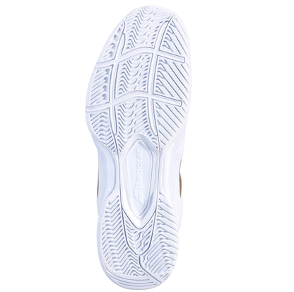 The image features the sole of the Babolat SFX3 All Court Wimbledon Women's Tennis Shoes in white and gold, showcasing a herringbone pattern designed for optimal grip. The "Babolat" branding is prominently embossed at the center, emphasizing its quality craftsmanship. This tennis shoe also includes an Ortholite Molded Insole to provide enhanced comfort and support on the court.