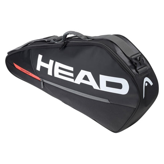 The HEAD Tour Team 3R 3 Racket Tennis Bag in Black/Orange prominently displays the "HEAD" logo in bold white letters. It is equipped with a top handle, an adjustable shoulder strap for easy transportation, and a handy zippered side pocket.