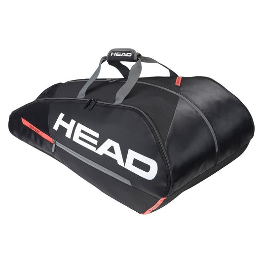 The HEAD Tour Team 12R Monstercombi 12 Racket Tennis Bag in Black and Orange showcases a sleek design, with the brand name "HEAD" prominently displayed in bold white on the side. It is equipped with climate control technology and features gray handles along with striking red accents, making it ideal for carrying and protecting your sports equipment.