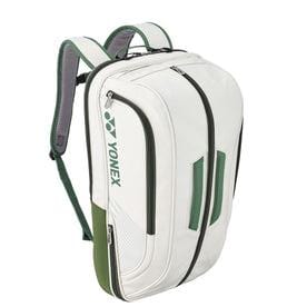 The Yonex 02312EX Expert Backpack in white and moss green boasts several zippered compartments, including a dedicated shoe pocket. With comfortable shoulder straps for easy carrying and the prominent Yonex logo on the side, it's ideal for use as both a sports backpack and a racket bag.