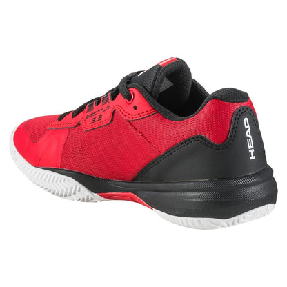 The HEAD Sprint 3.5 Junior Tennis Shoes in red and black boast non-marking white rubber soles, a breathable mesh upper, and black laces. Featuring the "HEAD" brand on the heel, these shoes are ideal for junior tennis players seeking a blend of style and performance for sports or casual wear.