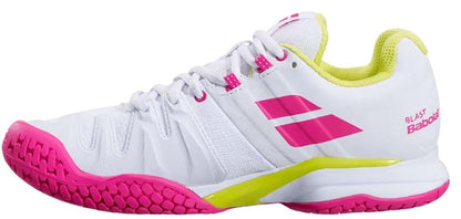 The Babolat Propulse Blast All Court Women's Tennis Shoes, offered by Babolat, showcase a unique white design accented with bright pink and red rose highlights. They feature a dual-colored sole in pink and lime green, along with a yellow interior lining. Designed for high-performance sports, these shoes include the Michelin Premium Tennis Sole for superior durability and grip.