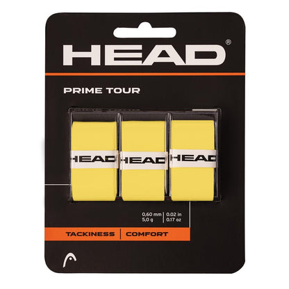 The packaging of the HEAD Prime Tour Tennis Overgrip (3 Pack) - Yellow showcases three vibrant grips, highlighting their exceptional tackiness and comfort. Each grip prominently features the HEAD logo, underscoring their design for serious players prioritizing performance and style.