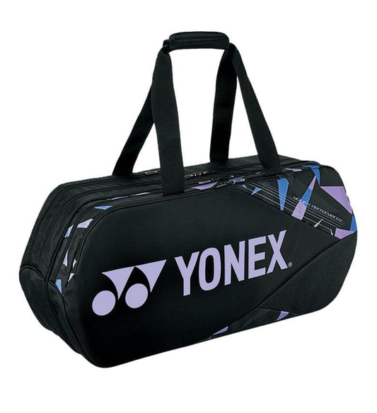 The Yonex 92231WEX Pro Tournament Bag in Mist Purple is a stylish sports bag with purple and blue accents. It offers professional-level quality, featuring dual handles for easy portability and a roomy central compartment. The distinctive Yonex logo adds the finishing touch to this tournament-inspired design.