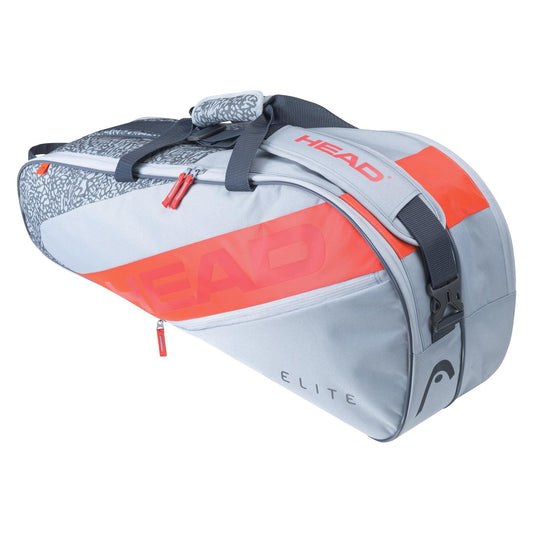 The HEAD Elite 6R Combi 6 Racket Tennis Bag in grey and orange features several compartments, secure zipper closures, and an eye-catching patterned handle. Crafted to comfortably transport your rackets and gear, it is an ideal selection for any tennis aficionado.
