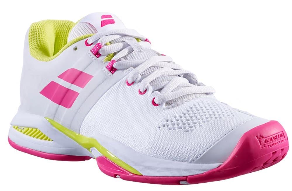 The Babolat Propulse Blast All Court Women's Tennis Shoes from Babolat are stylish, showcasing a white design with red rose accents on the sides and toe. Lime green details enhance the flair surrounding the Michelin Premium Tennis Sole, and white laces paired with a mesh texture complete these dynamic sneakers.