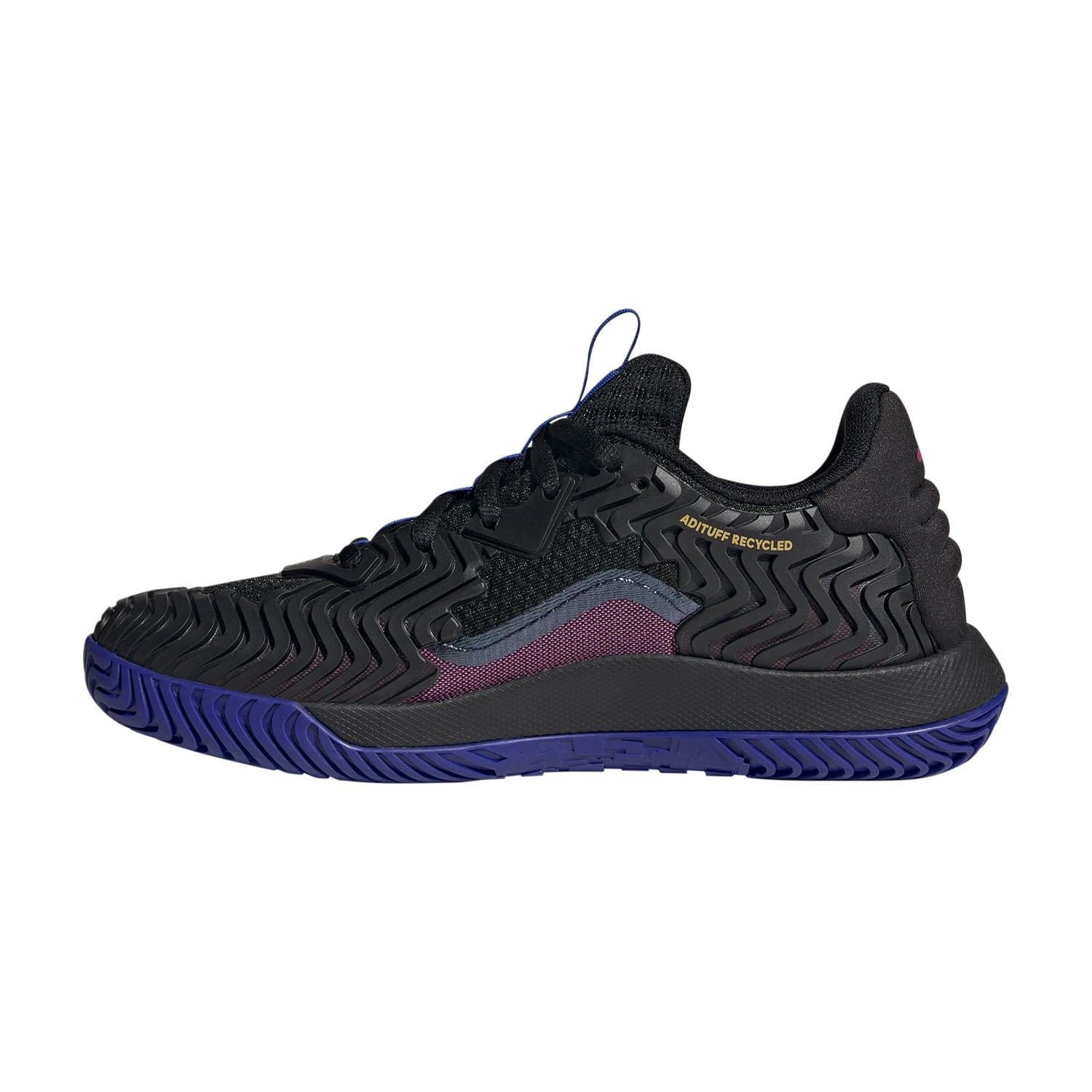 Introducing the adidas SoleMatch Control Men's Tennis Shoes in Black and Blue: This athletic shoe boasts a textured sole and Bounce Cushioning for superior comfort. It features mesh detailing and a distinctive wavy design on the side. Labeled as "Nature Recycled," it underscores its eco-friendly material composition, delivering abrasion resistance for enhanced performance on the court.