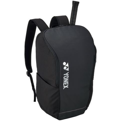 The Yonex 42312SEX Team Backpack - Black, ideal for racket sports enthusiasts, boasts a sleek black design with the Yonex logo prominently displayed on the front. It includes two adjustable shoulder straps and a distinctive tennis racket handle elegantly protruding from the top.