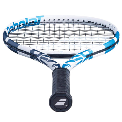 A close-up image of the Babolat Evo Drive Tennis Racket - White (Strung) reveals its blue and white frame with black strings. The handle is black with a logo on the butt cap, making it appealing to intermediate players. The Babolat brand name is partially visible on the frame.