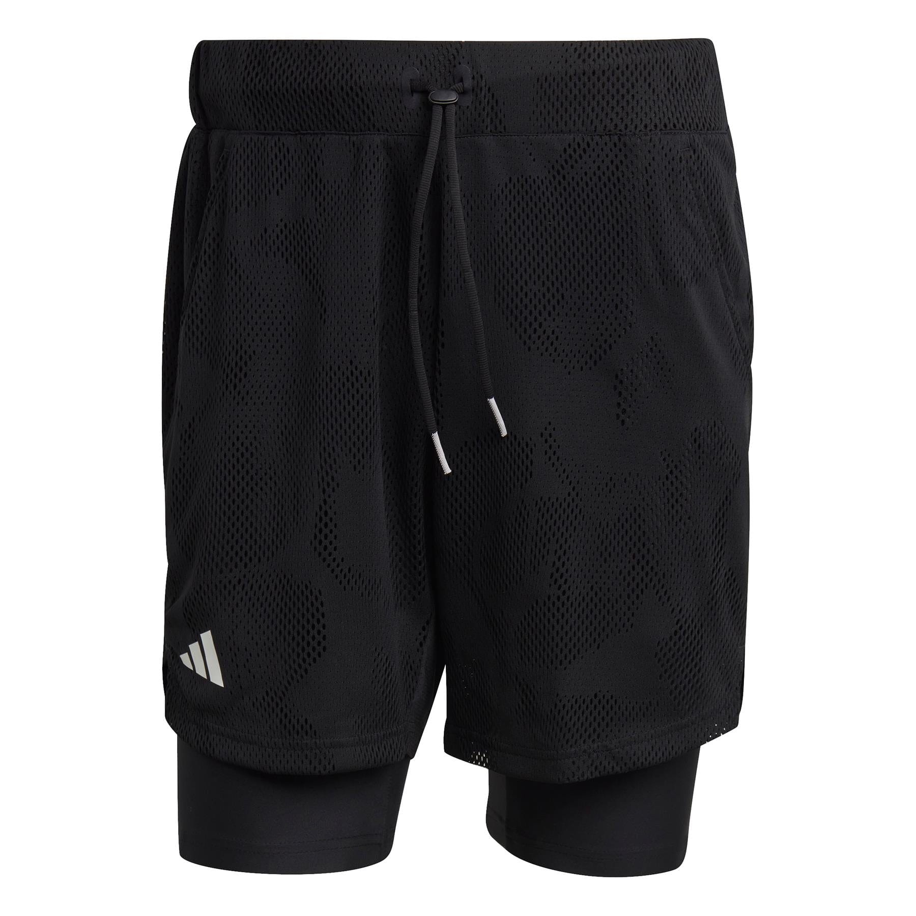 The adidas Melbourne 2in1 Mens 7 Inch Tennis Shorts in black boast a subtle camo pattern and are crafted with a double-layer design. The outer mesh shorts include an elastic waistband with a drawstring, while the inner layer offers additional coverage. A small adidas logo is prominently displayed near the left hem.