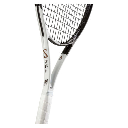 A close-up of the HEAD Speed MP 2022 tennis racket showcases black strings set against a white frame. The frame prominently features the word "SPEED" in bold, dark lettering and incorporates cutting-edge Auxetic technology. The racket's handle is elegantly wrapped in a sleek white grip, utilizing Graphene Inside to ensure optimal performance.