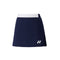 The Yonex 26094 Women's Skort in navy blue showcases a white waistband and a small logo on the bottom left. It includes gentle pleating on one side and utilizes VERY COOL TECHNOLOGY for improved comfort.