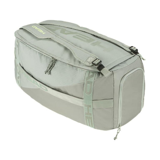 Introducing the gray HEAD Pro Tennis Duffle Bag M - LNLL, a versatile gym companion featuring multiple compartments and a secure zipper closure. It offers adjustable shoulder straps for comfort and proudly displays the iconic HEAD logo on its sides.