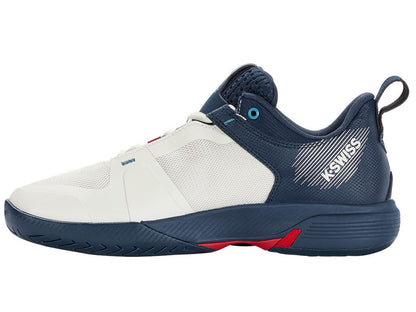 The K-Swiss Ultrashot Team Men's Tennis Shoes, in a White, Blue Opal, and Lollipop colorway, showcase a low-top design. They include a textured sole for improved on-court performance, a handy pull tab at the heel, and prominently display the iconic "K-Swiss" brand name on the side.