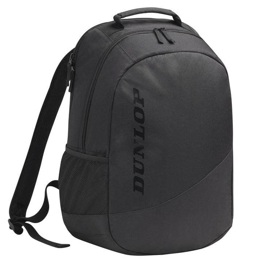 Introducing the Dunlop CX Club Tennis Backpack in black, featuring a sleek, minimalist design. It is equipped with a top handle, ergonomic shoulder straps, and a side pocket for added convenience. The brand name is printed vertically on the front, making it perfect for carrying your rackets in style.